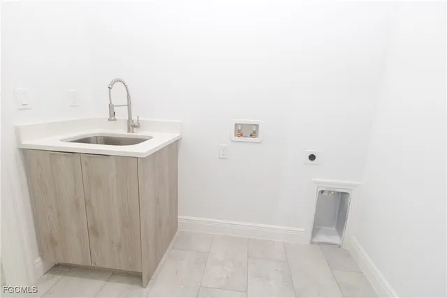 a bathroom with a sink a mirror and vanity