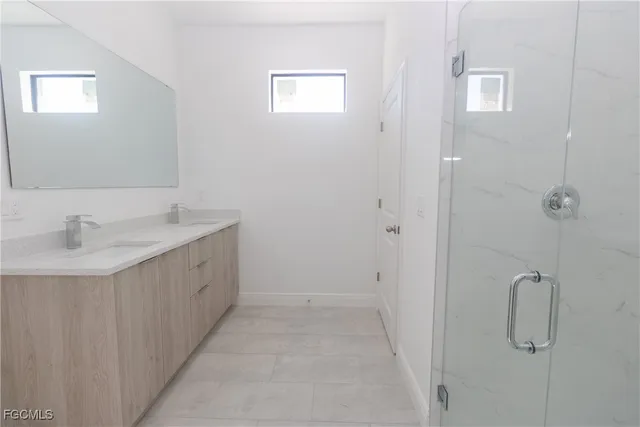 a bathroom with a sink and mirror