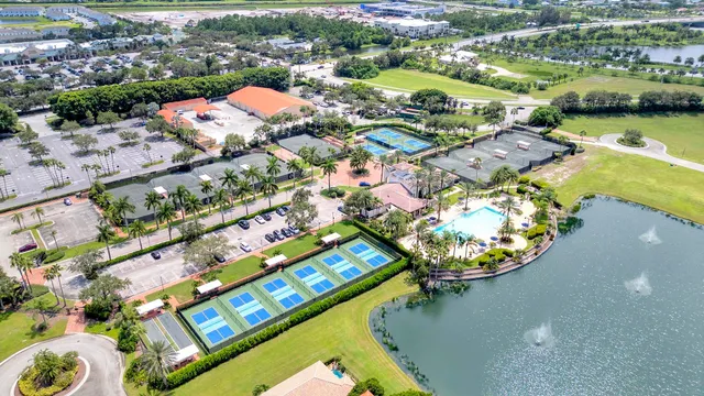 an aerial view of a resort with swimming pool and ocean view