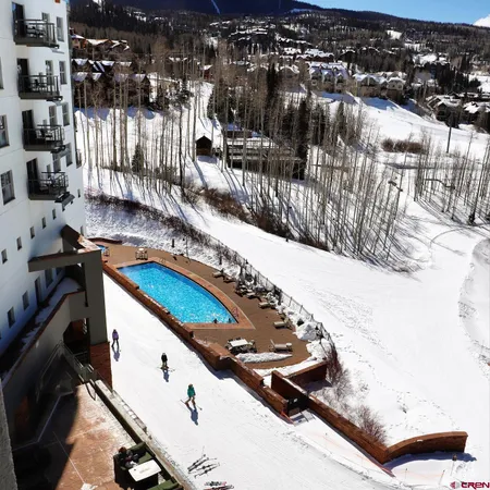 a view of a balcony with furniture