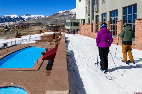a view of swimming pool with a chairs
