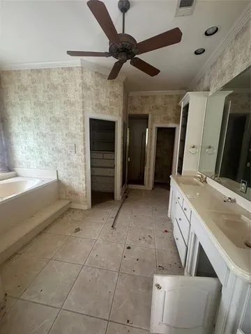 a bathroom with a sink a vanity and a mirror
