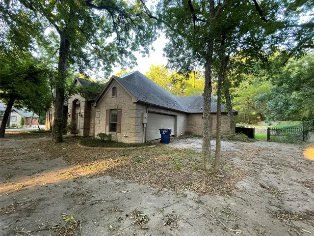a house with trees in the background