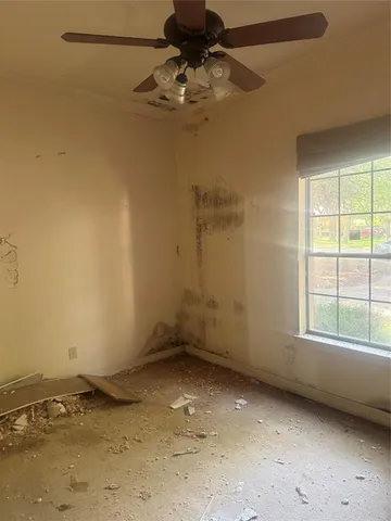 a view of a room with window and a chandelier