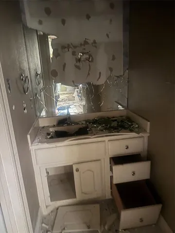 a stove top oven sitting inside of a kitchen