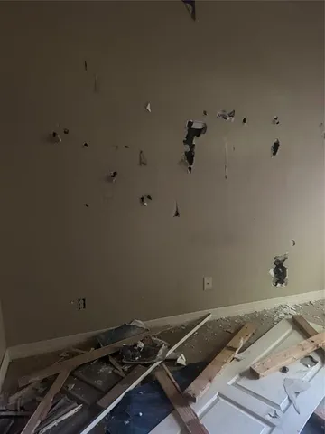 a bed sitting in a bathroom next to a sink