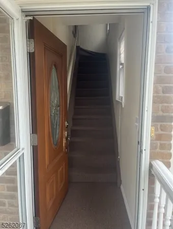 a view of staircase with white walls