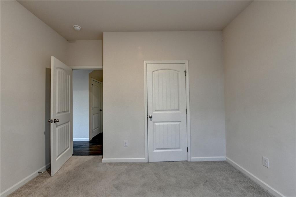 393 Walnut Grv Way Pendergrass, GA 30567 - Photo 21 of 45 an empty room with closet area