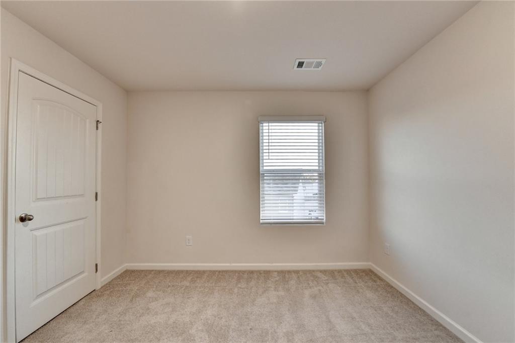 393 Walnut Grv Way Pendergrass, GA 30567 - Photo 35 of 45 a view of an empty room with a window