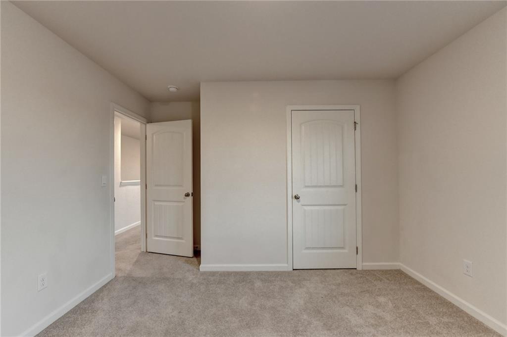 393 Walnut Grv Way Pendergrass, GA 30567 - Photo 36 of 45 a view of an empty room and closet area