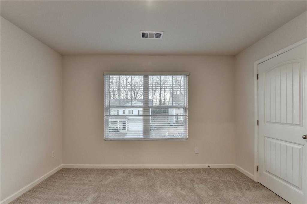 393 Walnut Grv Way Pendergrass, GA 30567 - Photo 38 of 45 an empty room with a window