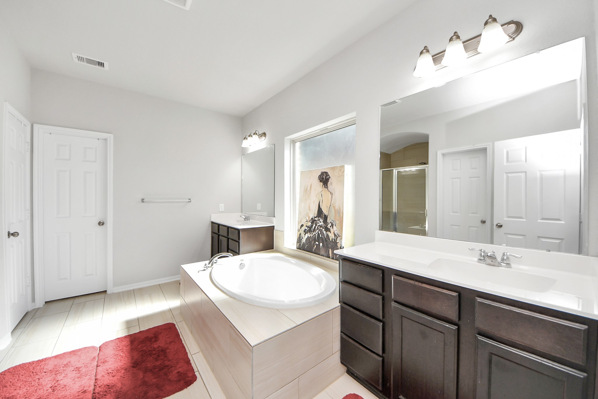 14611 Sycamore Side Way Cypress, TX 77429 - Photo 25 of 46 a bathroom with a sink double vanity and a mirror