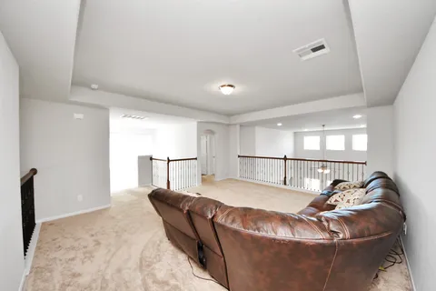 a view of a backyard with sitting area