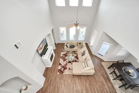 an aerial view of a house with a swimming pool
