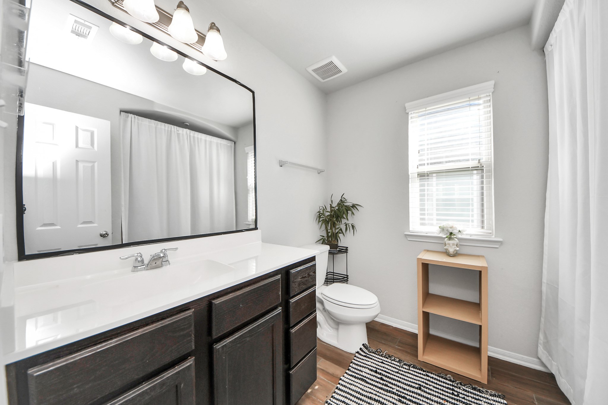 14611 Sycamore Side Way Cypress, TX 77429 - Photo 35 of 46 a bathroom with a sink a toilet and a window