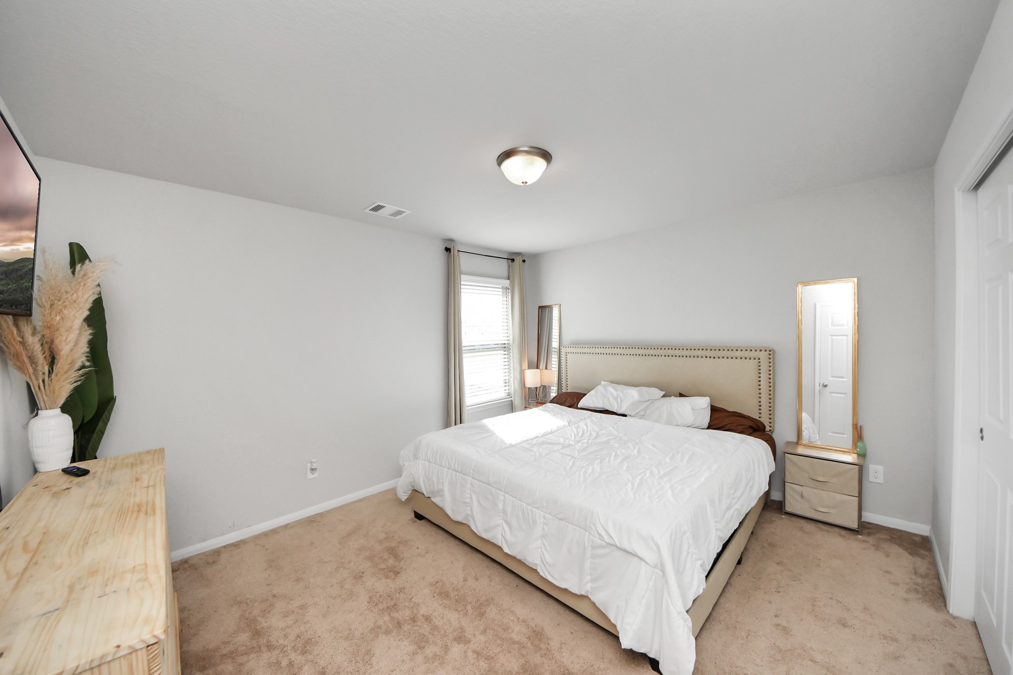 14611 Sycamore Side Way Cypress, TX 77429 - Photo 36 of 46 a bedroom with a bed and a flat screen tv