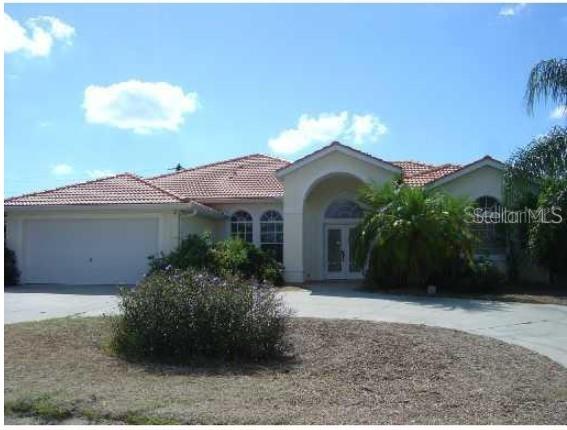 108 Raphael Place Nokomis, FL 34275 - Photo 1 of 1 a front view of a house with a garden