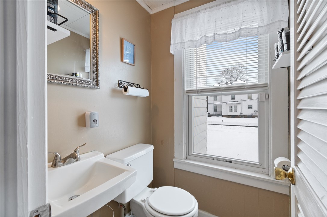 135 Wilson Street Arcadia, NY 14513 - Photo 10 of 27 The first floor half bath- conveniently located ne