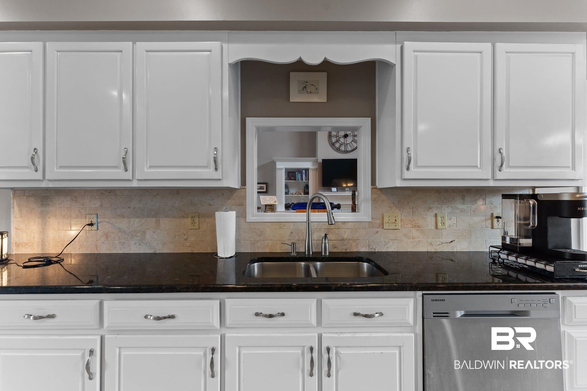 525 Norwood Road Monroeville, AL 36460 - Photo 16 of 55 Kitchen with dark stone counters, stainless steel dishwasher, backsplash, and white cabinets