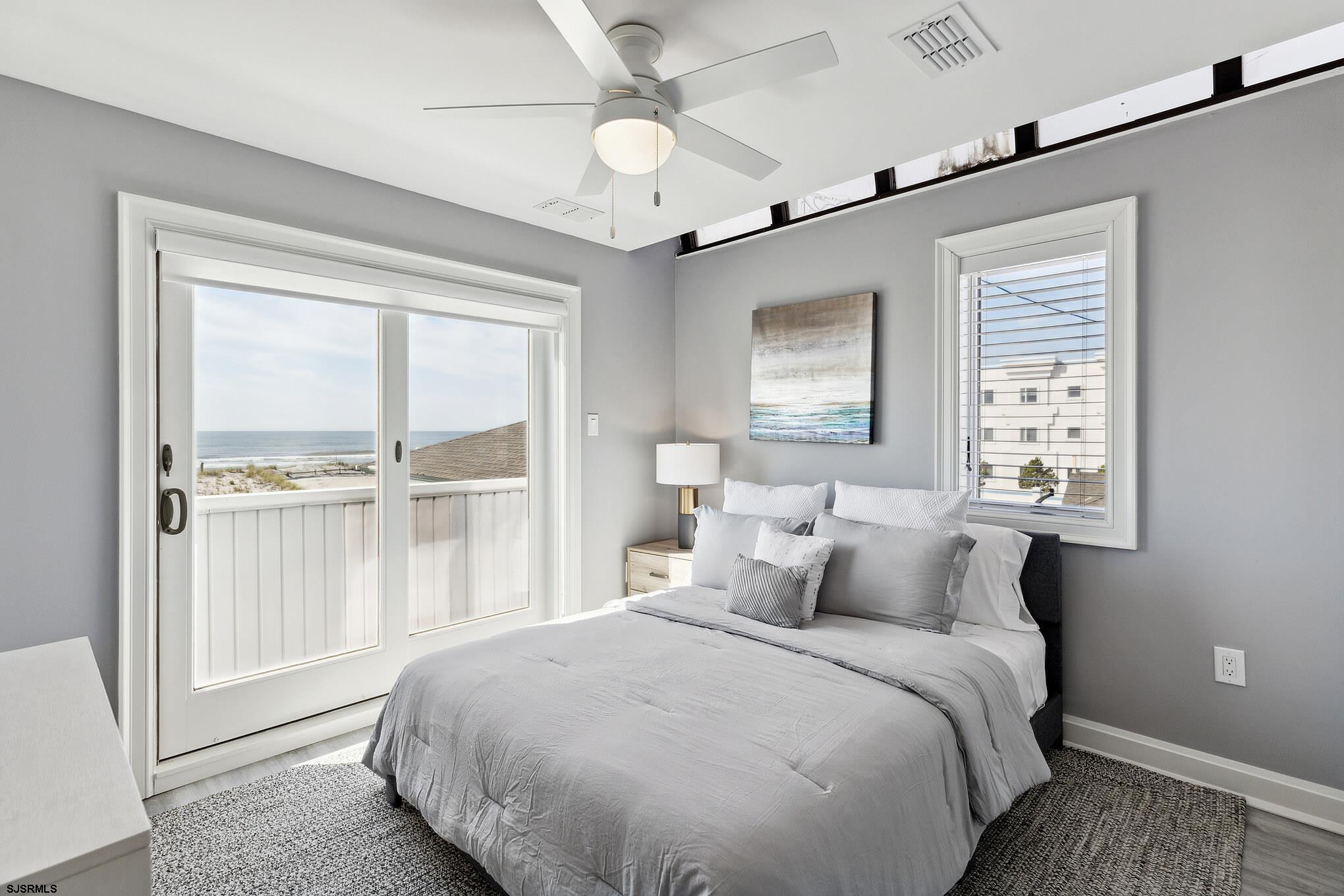 111 South Decatur Avenue Margate City, NJ 08402 - Photo 27 of 39 a bedroom with a large bed and a window