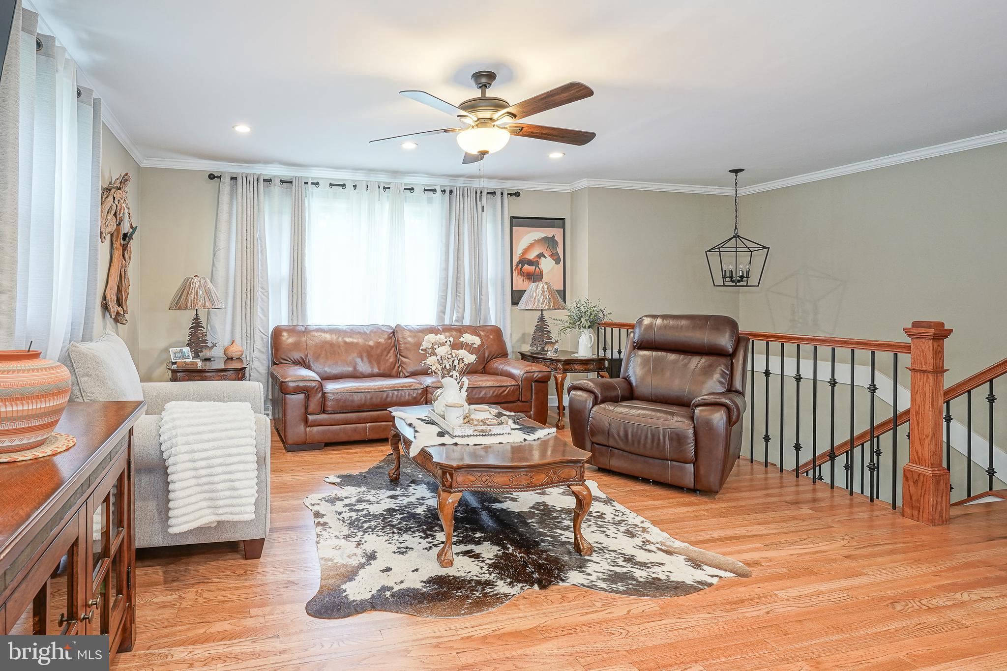 1024 Oxmead Road Eastampton, NJ 08060 - Photo 9 of 39 a living room with furniture ceiling fan and a rug