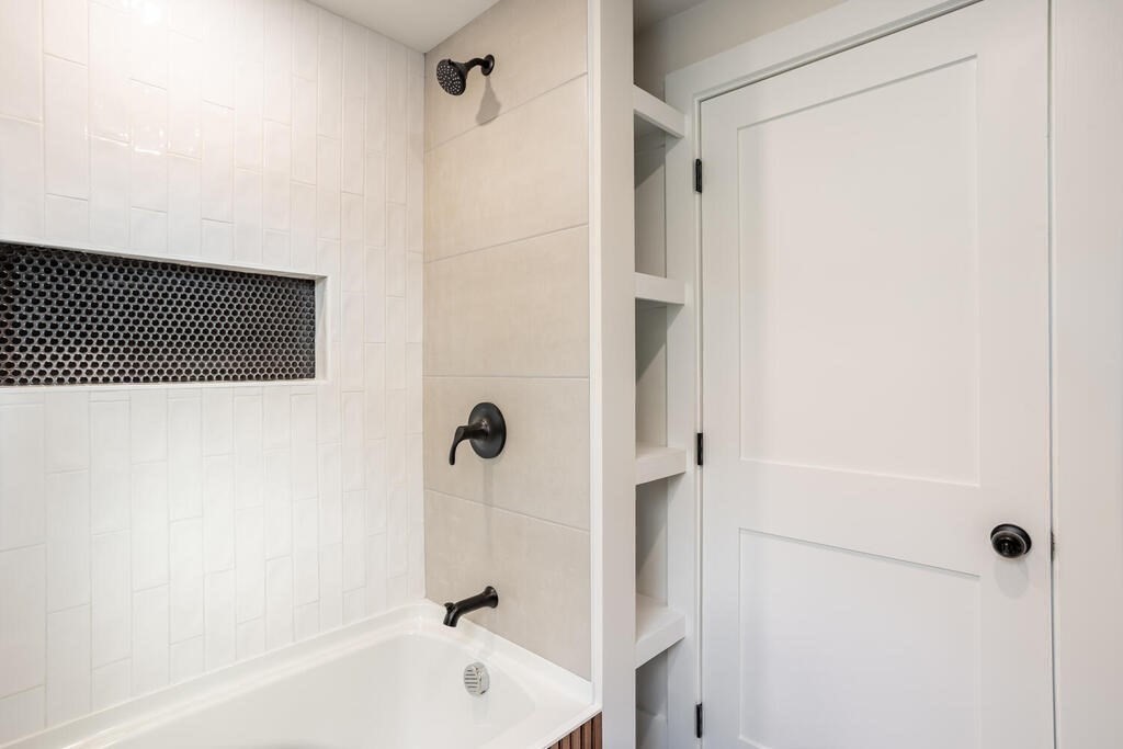 79 Bonham Road Dedham, MA 02026 - Photo 19 of 28 a bathroom with a bathtub and a shower