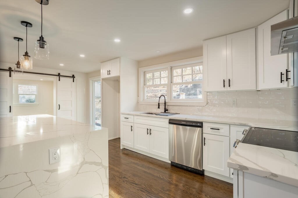 79 Bonham Road Dedham, MA 02026 - Photo 2 of 28 a kitchen with granite countertop white cabinets and white appliances