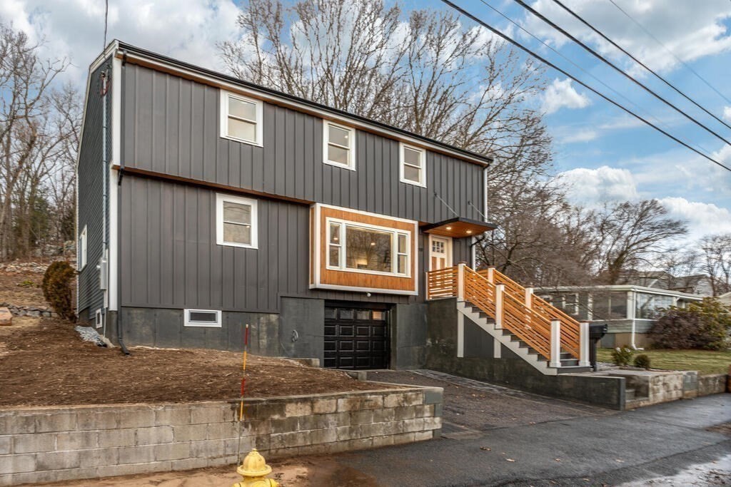 79 Bonham Road Dedham, MA 02026 - Photo 21 of 28 a front view of a house with stairway