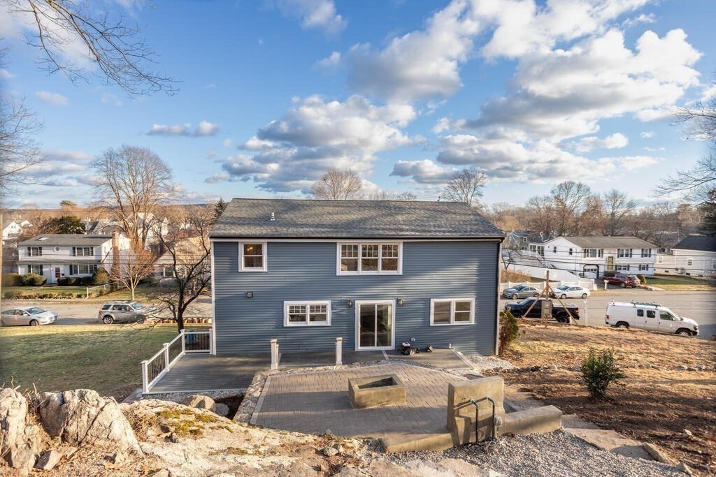 79 Bonham Road Dedham, MA 02026 - Photo 23 of 28 a front view of a house with a yard