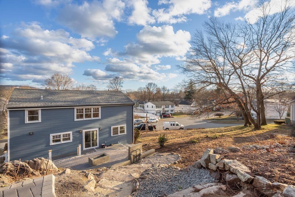 79 Bonham Road Dedham, MA 02026 - Photo 28 of 28 a view of a yard covered with snow in the roadside