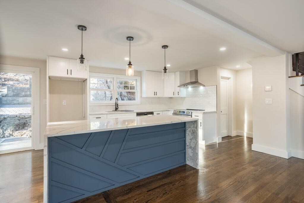 79 Bonham Road Dedham, MA 02026 - Photo 3 of 28 a kitchen with wooden floors and cabinets