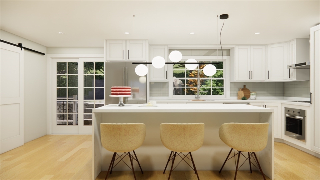 79 Bonham Road Dedham, MA 02026 - Photo 4 of 28 a kitchen with a stove a sink and white cabinets