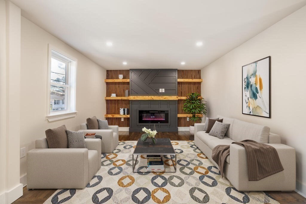 79 Bonham Road Dedham, MA 02026 - Photo 9 of 28 a living room with furniture and a fireplace