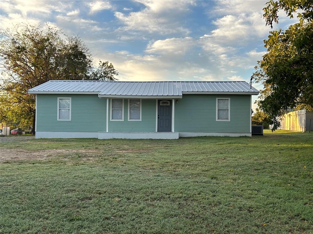 1502 East Highland Avenue Comanche, TX 76442 - Photo 1 of 1 a house with a outdoor space