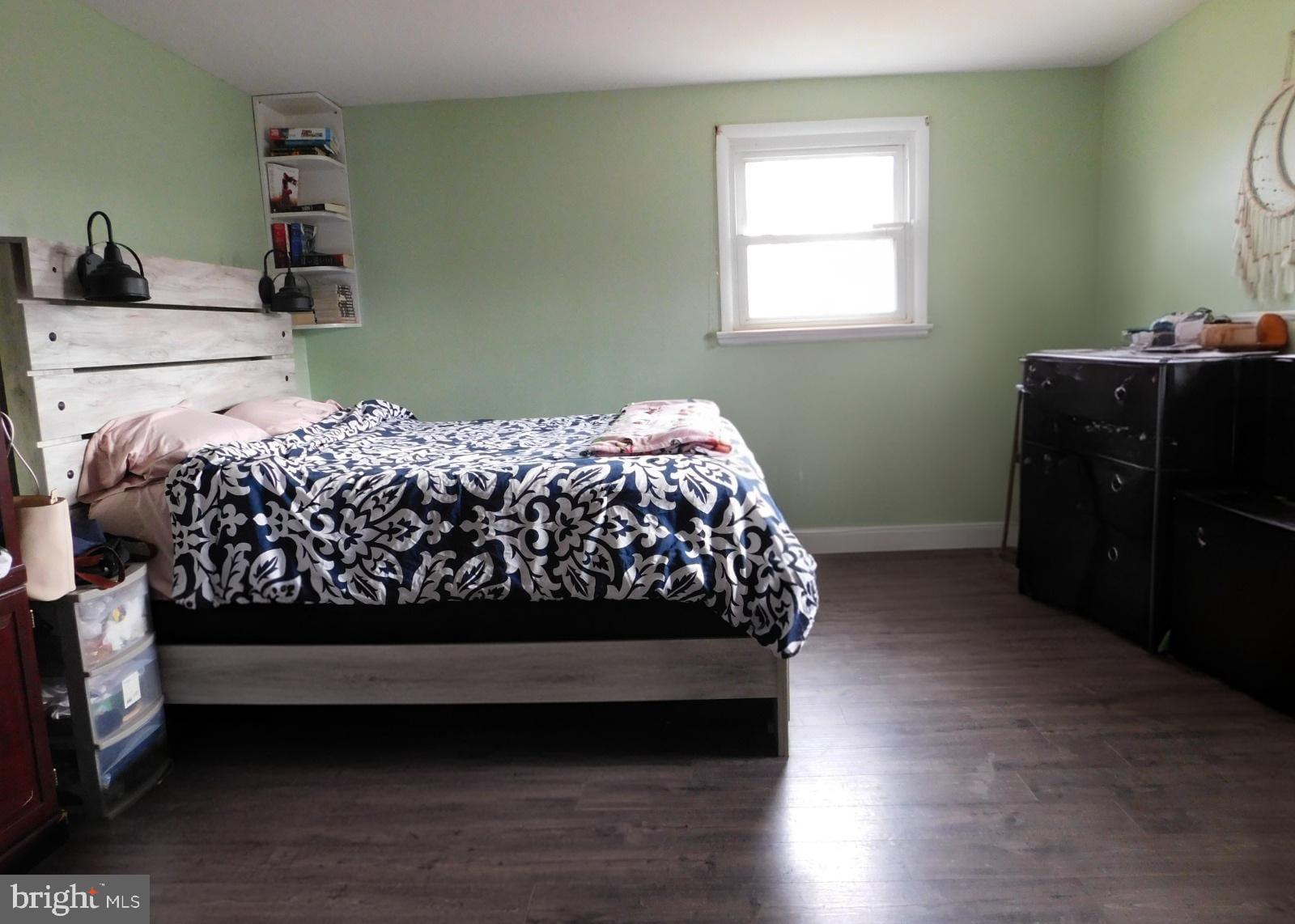 38777 Holmes Mill Road Hamilton, VA 20158 - Photo 6 of 14 a bed sitting in a bedroom next to a window