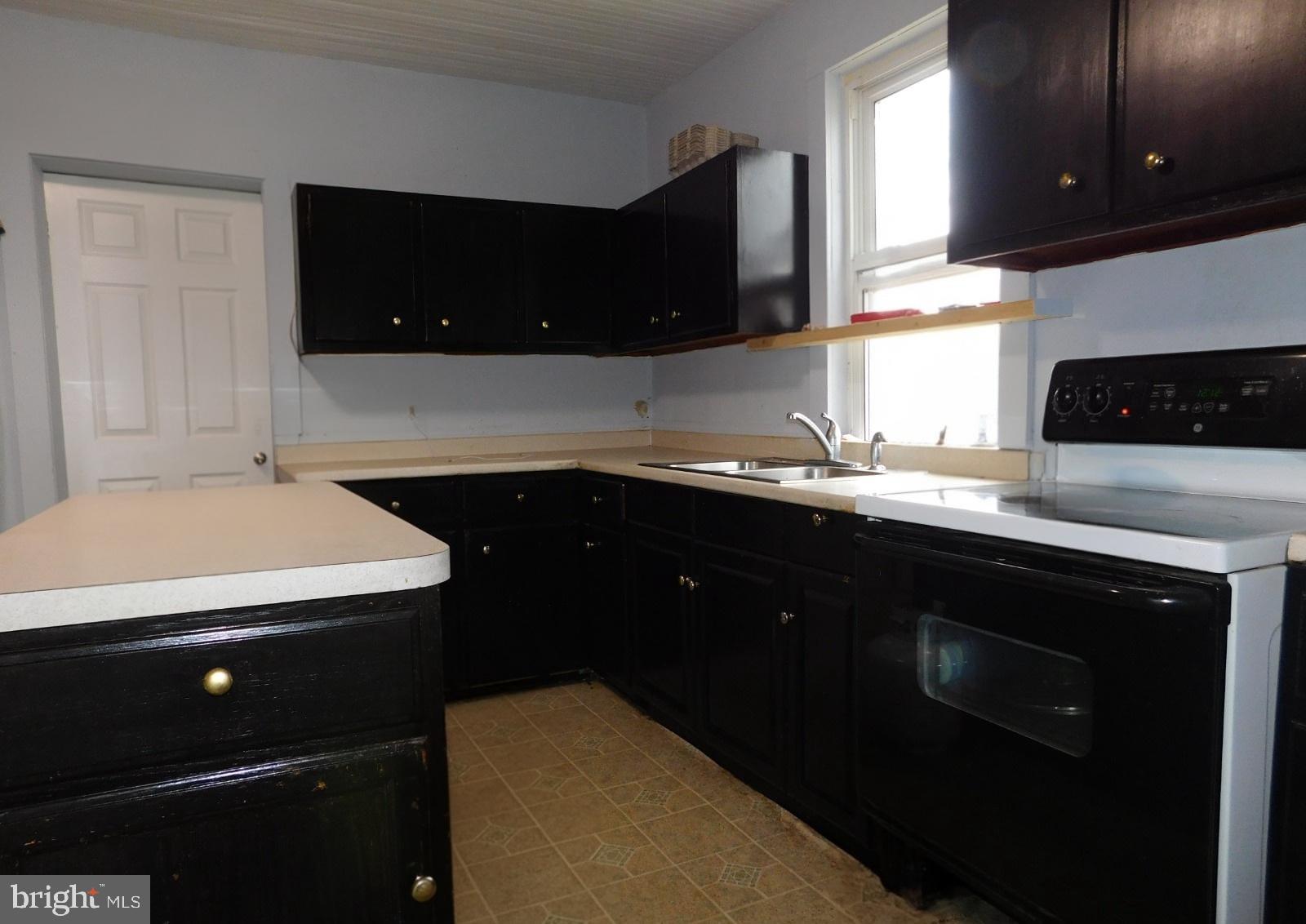 38777 Holmes Mill Road Hamilton, VA 20158 - Photo 9 of 14 a kitchen with a sink and a stove top oven