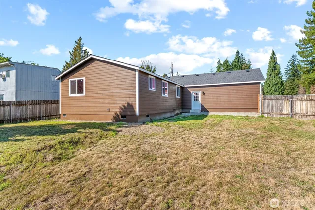 a house view with a backyard space
