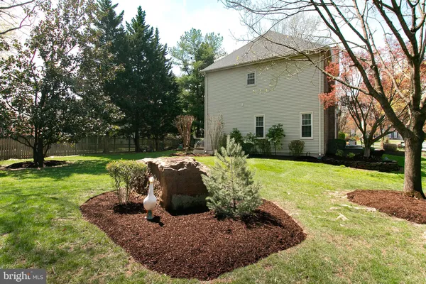 a view of a couches in backyard of house