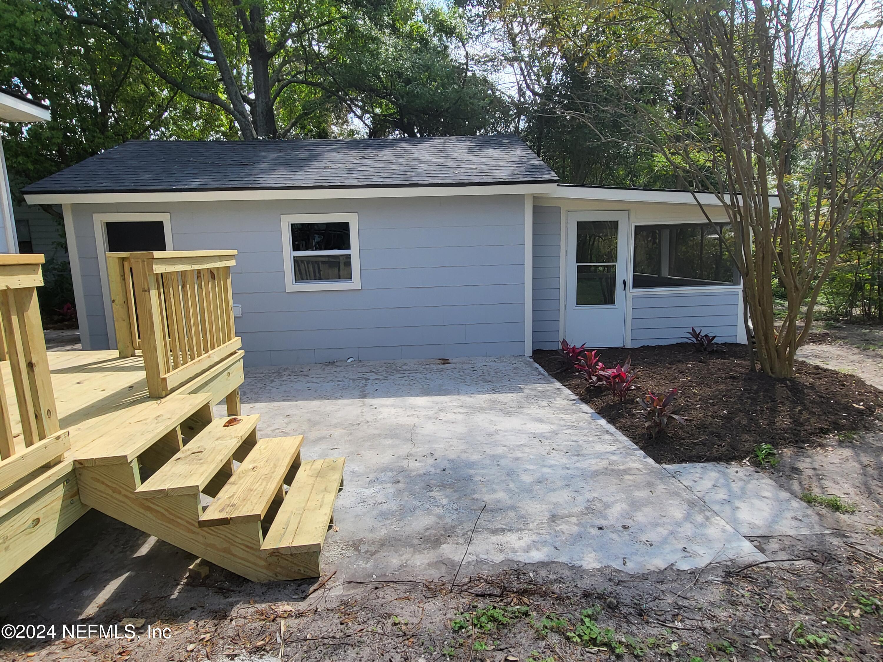 4718 Dundee Road Jacksonville, FL 32210 - Photo 3 of 37 a view of a house with backyard and sitting area