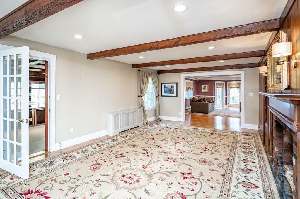 64 Garland Road Newton, MA 02459 - Photo 13 of 27 a view of a bedroom with wooden floor and a fireplace