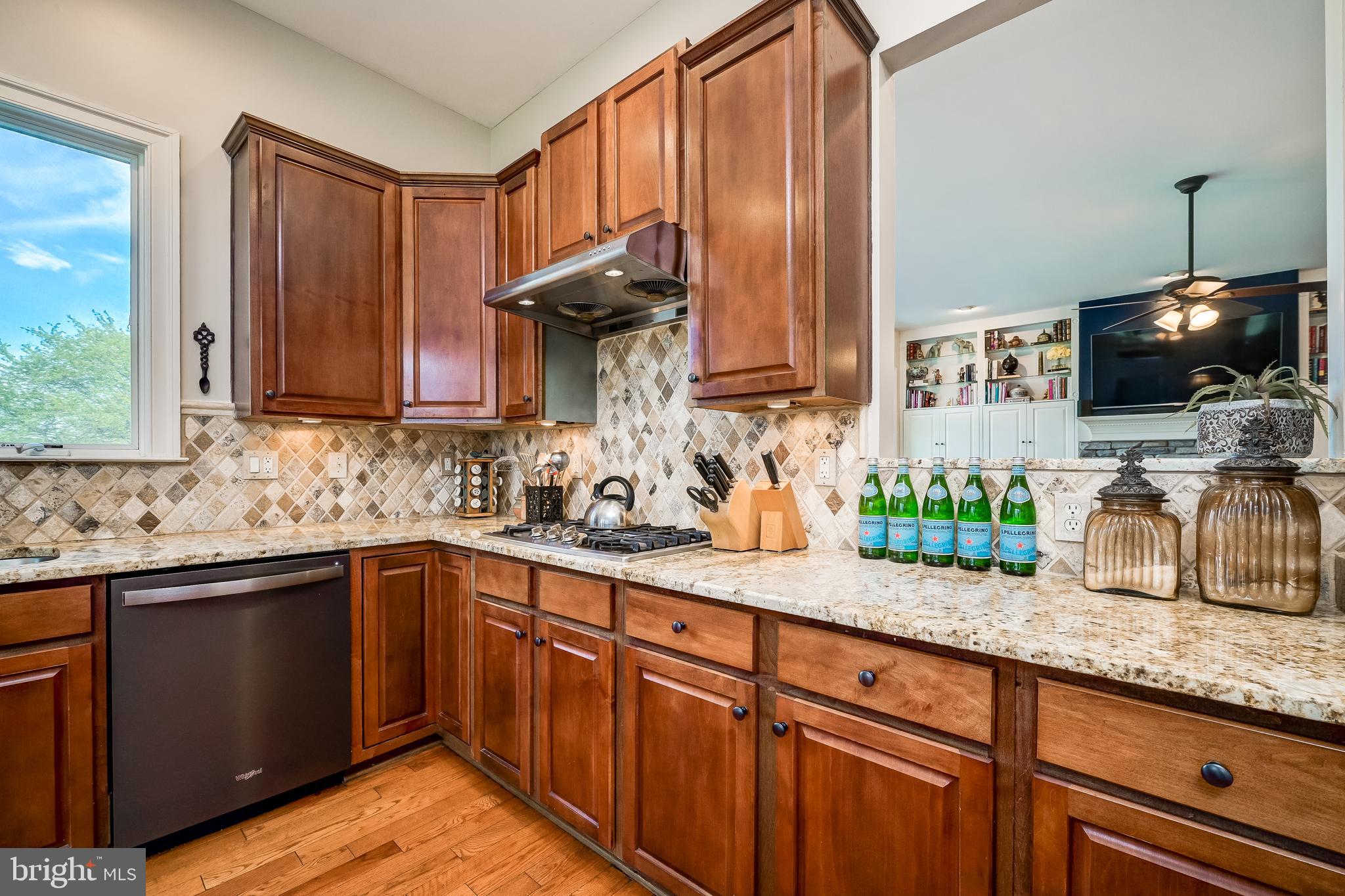 12850 Highland Road Highland, MD 20777 - Photo 16 of 56 a kitchen with stainless steel appliances granite countertop a sink a stove and a microwave