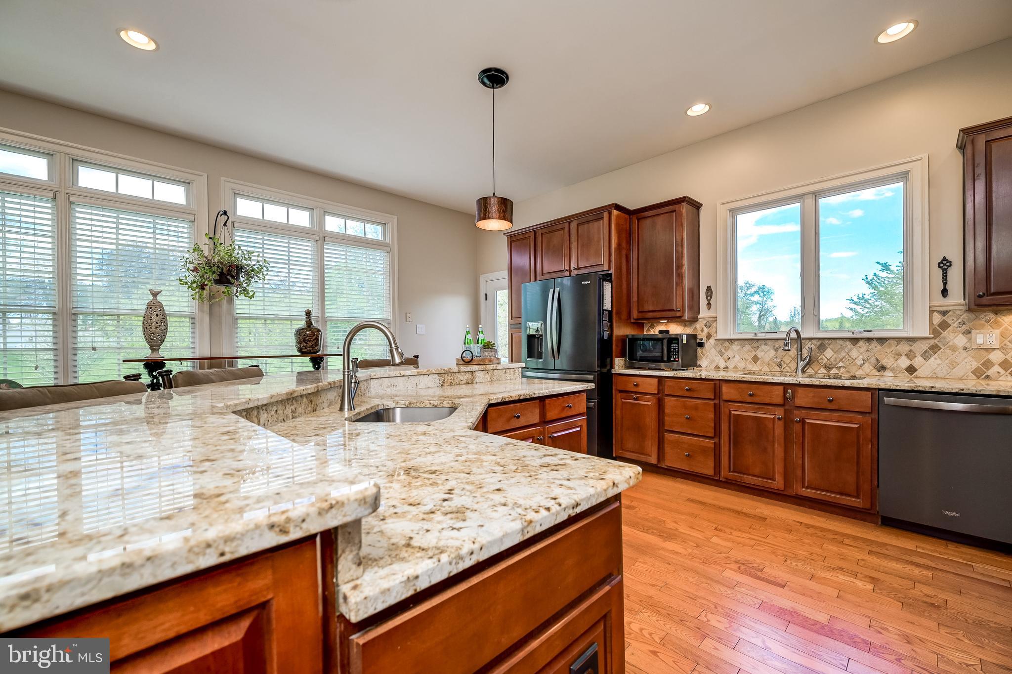 12850 Highland Road Highland, MD 20777 - Photo 17 of 56 a kitchen with large counter top space appliances and a large window