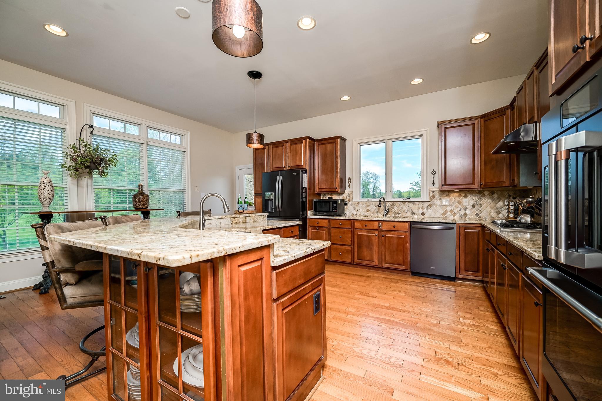 12850 Highland Road Highland, MD 20777 - Photo 18 of 56 a kitchen with granite countertop counter space a sink appliances and cabinets