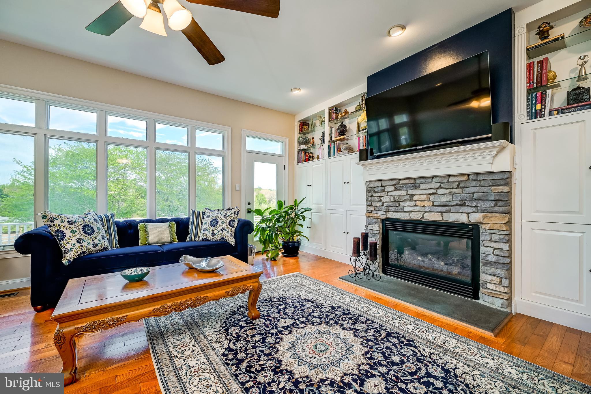 12850 Highland Road Highland, MD 20777 - Photo 19 of 56 a living room with fireplace furniture and a flat screen tv
