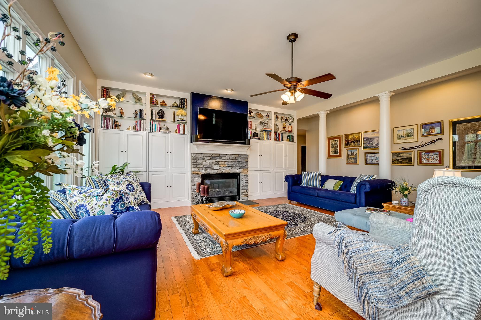 12850 Highland Road Highland, MD 20777 - Photo 20 of 56 a living room with furniture a flat screen tv and a fireplace