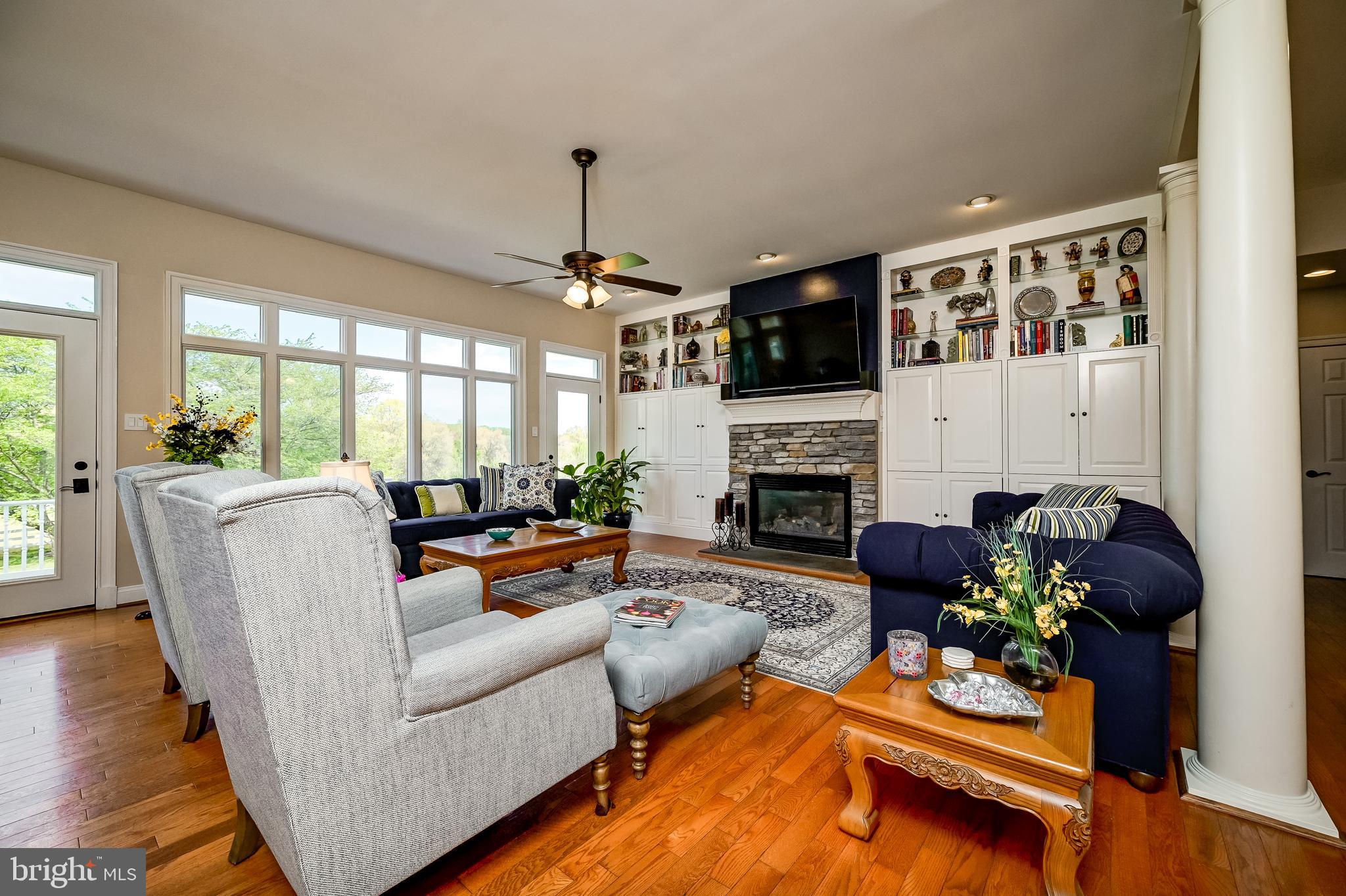 12850 Highland Road Highland, MD 20777 - Photo 21 of 56 a living room with furniture fireplace and flat screen tv