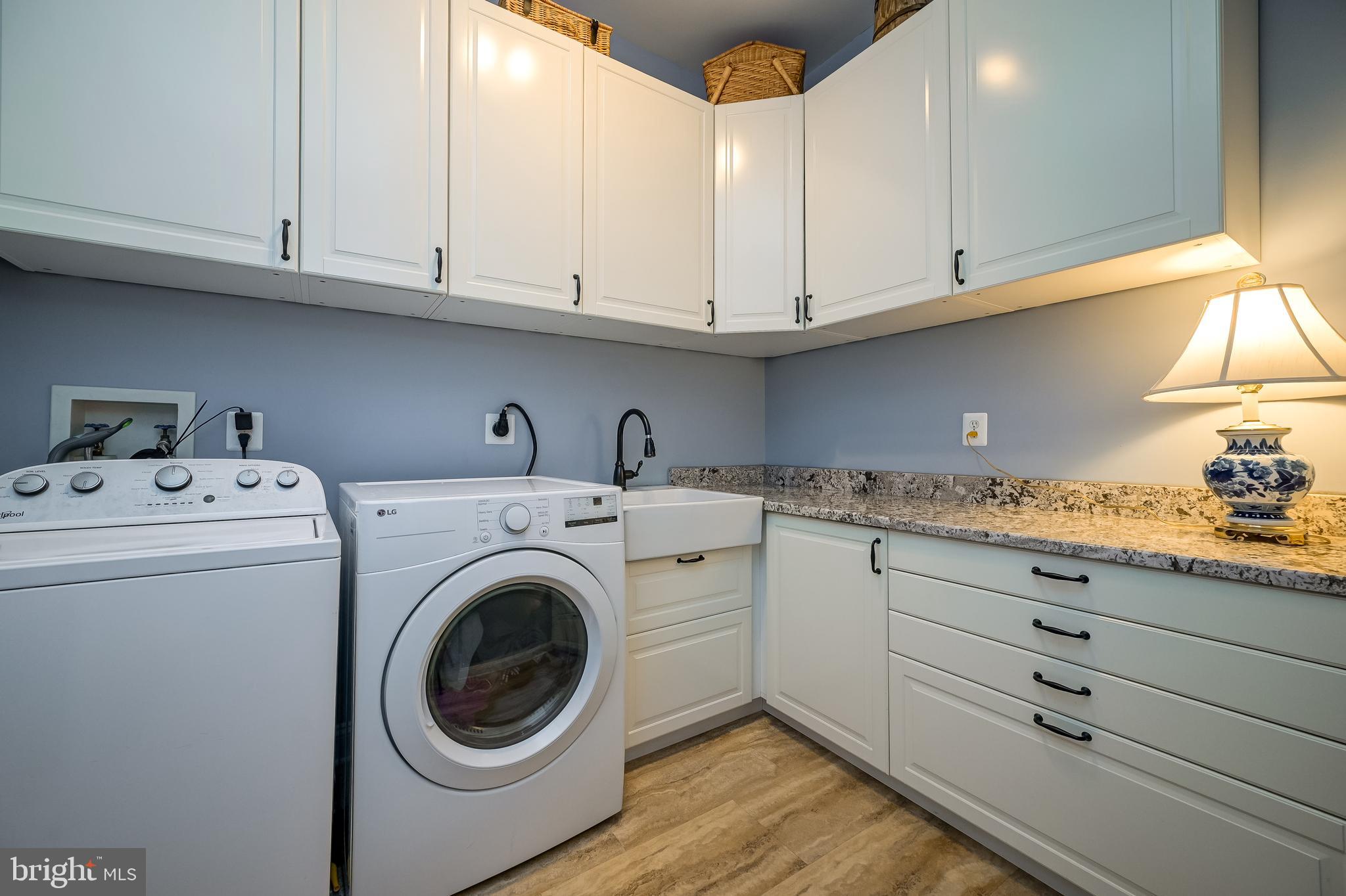 12850 Highland Road Highland, MD 20777 - Photo 24 of 56 a utility room with sink dryer and washer