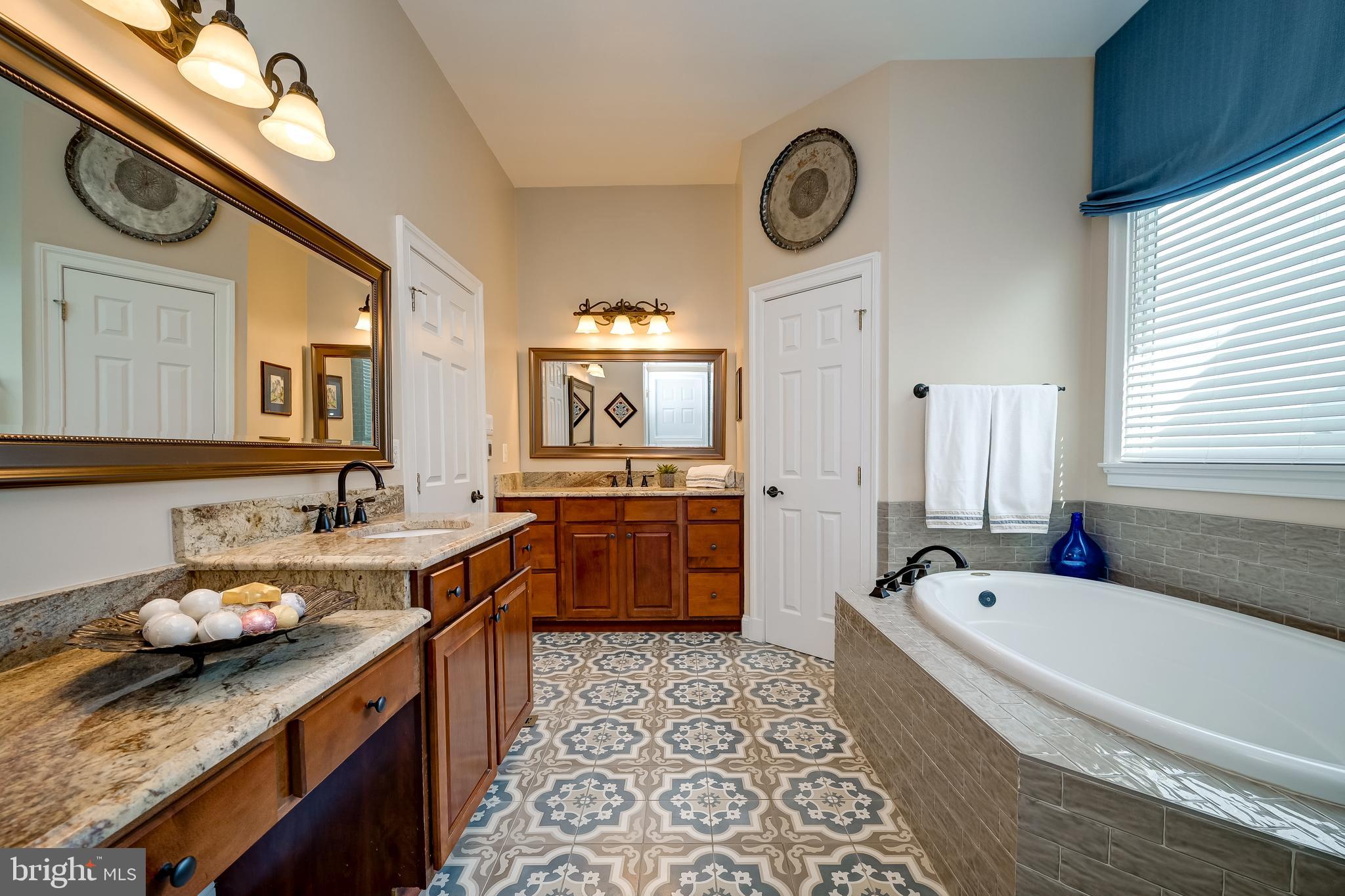 12850 Highland Road Highland, MD 20777 - Photo 29 of 56 a large bathroom with a tub sink and a mirror