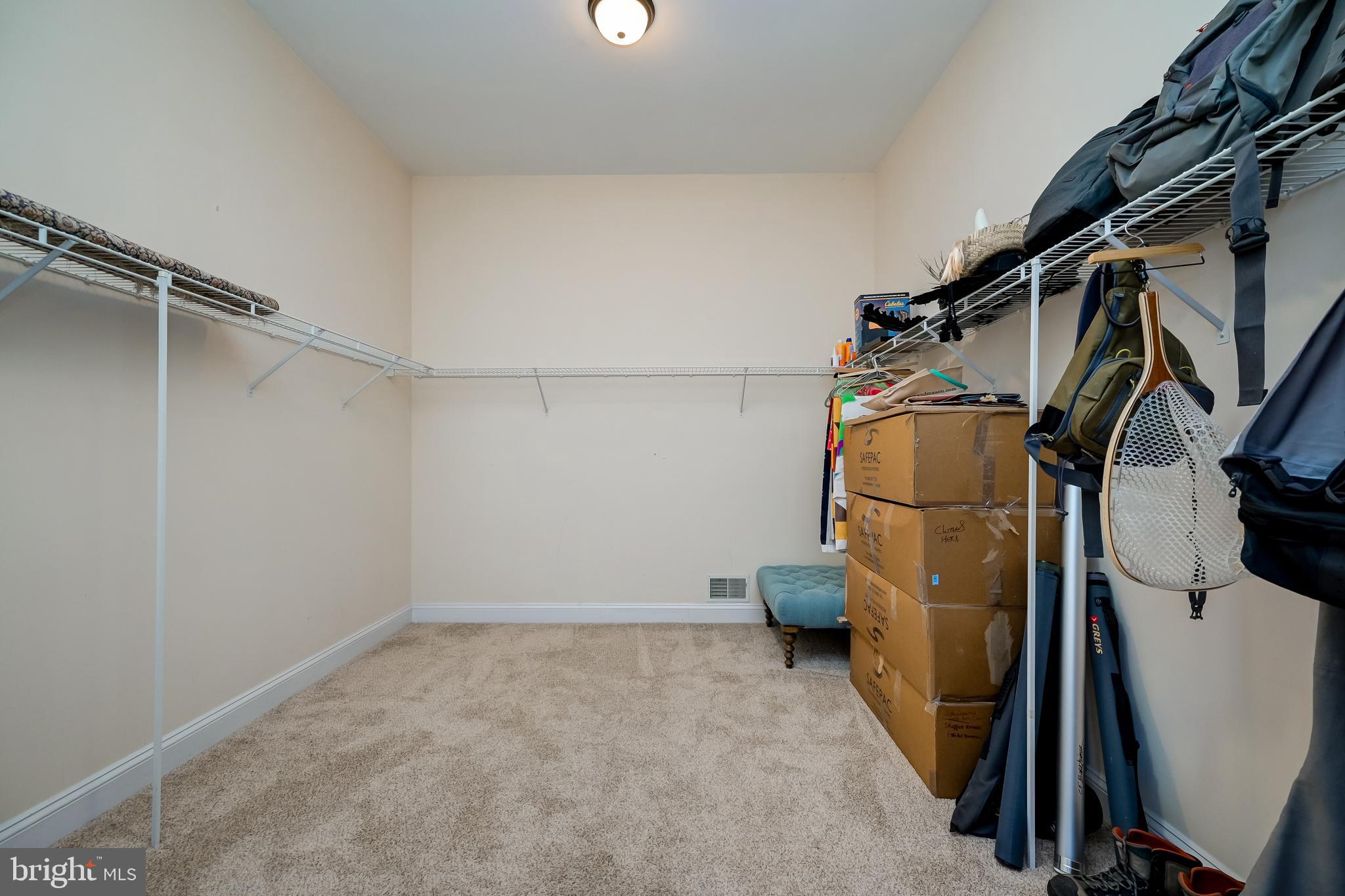 12850 Highland Road Highland, MD 20777 - Photo 30 of 56 a view of walk in closet with clothes and shoes