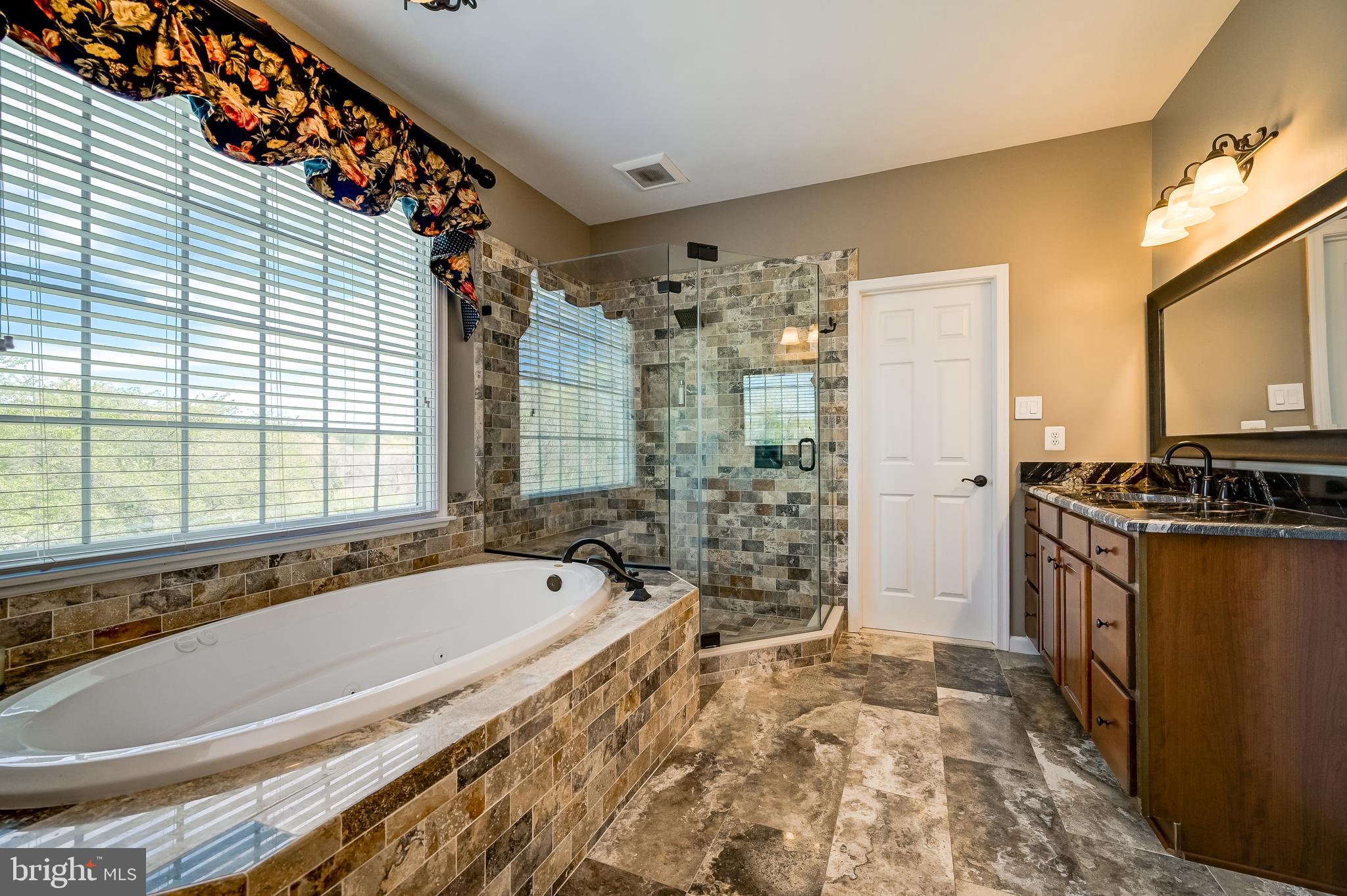 12850 Highland Road Highland, MD 20777 - Photo 33 of 56 a spacious bathroom with bathtub and shower